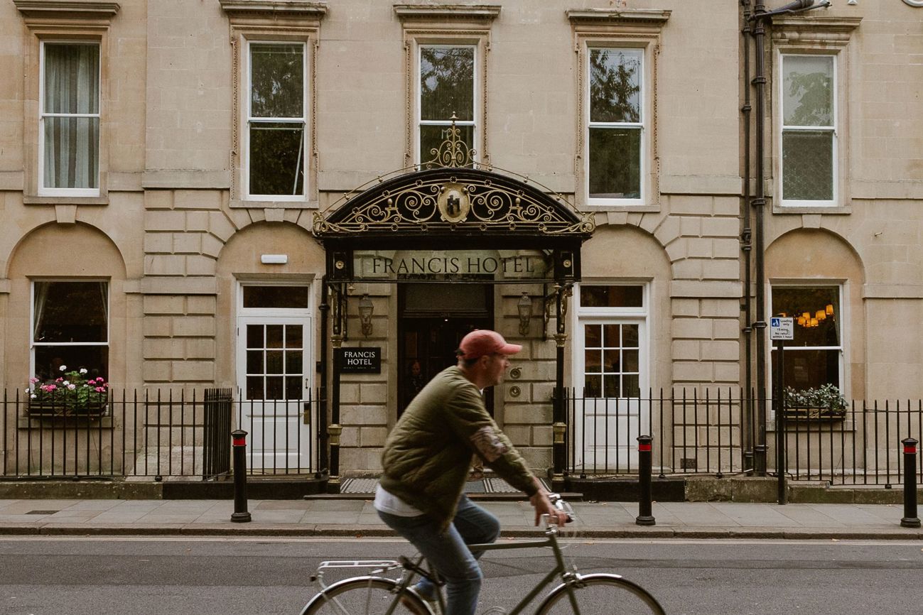 Cycling past Francis Hotel